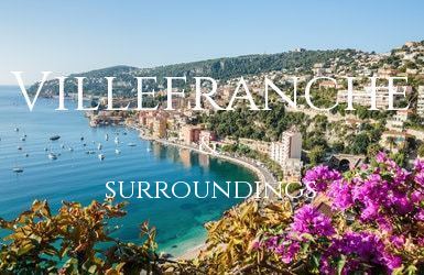 Looking down on the Bay of Villefranche with pink flowers in the foreground