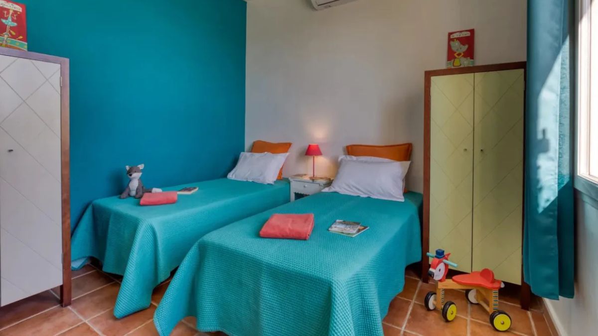 Twin bedroom with children's toys