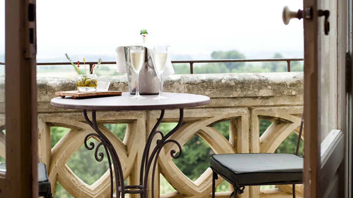 Table with champagne for two on French chateau balcony