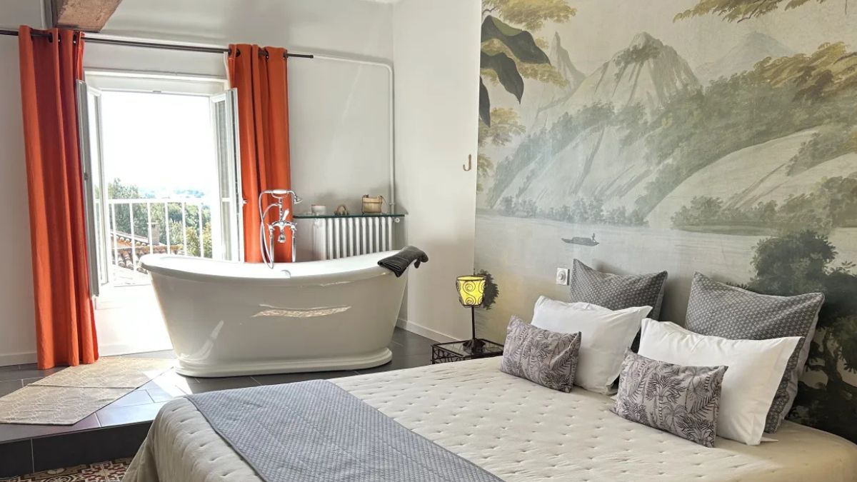 French style bedroom with bathtub and balcony